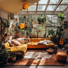 a living room filled with lots of plants and furniture