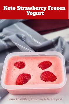 a plastic container filled with yogurt and strawberries on top of a table