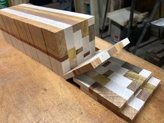 several pieces of wood sitting on top of a wooden table