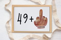 a card with the number nine and a hand drawn on it