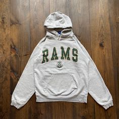 Vintage 1990s Colorado State Rams University College Varsity Athletic Apparel Hoodie Sweatshirt / see measurements for sizing  Pit to Pit:   19" Length:   23" Sleeve:   27" No tag size, fits around a Small. Please check the measurements before purchasing  -------------------------------- ⚠️ Please Note: All of our items are vintage. Please note that with vintage clothing, items may show some signs of wear. We do our best to include as much information about the items condition as possible. Pleas Vintage Green Long Sleeve Hoodie, Vintage Green Cotton Hoodie, Green Vintage Cotton Hoodie, Vintage Cotton Hoodie With Letter Print, Vintage College Hoodie With Drawstring Hood, Vintage Hoodie With Drawstring Hood For College, Vintage Hoodie For College, Vintage College Hoodie Tops, 90s Style Cotton Hoodie For College