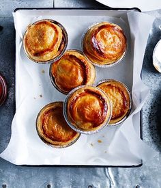 there are many pies on the tray ready to be eaten