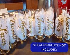 there are many glasses that have been decorated with gold lettering on them, and the price is $ 15