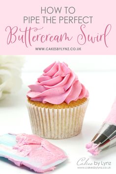 a cupcake with pink frosting on it next to a knife and paintbrush