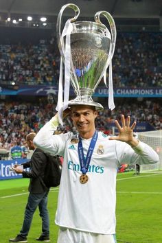 real madrid's forward cristianoo celebrates with the trophy