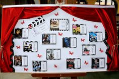 a white board with red curtains and pictures attached to it's sides, in front of a red curtain