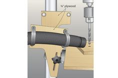 an image of a drill being used to fix a piece of wood