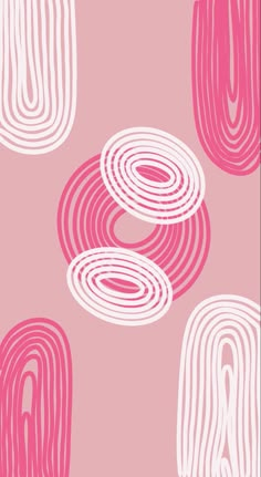 a pink and white wallpaper with circles on it