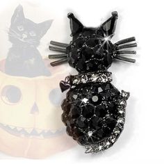 "Our dimensional black cat brooch has a definite vintage vibe.  He is set with jet black premium Swarovski crystal, his a collar and tail sparkling with clear stones. A tiny heart dangles from his collar. 1.75 x .75\"   Black cats are wonderful and we consider ourselves lucky to have them in our lives. He is guaranteed to welcome a lifetime of Halloween smiles. Made in our Los Angeles studio." Black Halloween Party Brooch, Hippie Wedding, Sweet Romance, Cat Brooch, Tiny Heart, Bridal Bracelet, Vintage Vibe, Retro Halloween, Vintage Brooch