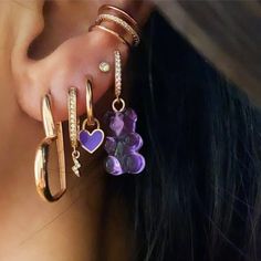 Add a pop of whimsy to your summer outfit with our Candy Bear Earring! This colorful huggie earring is made with rose gold-plated 925 silver and features an adorable gummy bear charm. Perfect for those who love playful and unique accessories. Metal: 925 sterling silver Coating: 18k rose gold The package contains one earring Hypoallergenic: nickel-free materials used therefore suitable for those with metal allergies Trendy Huggie Earrings For Party, Trendy Pink Huggie Earrings, Trendy Rose Gold Huggie Earrings For Gift, Jelly Candy, Huggie Earring, Earring Silver, Unique Accessories, Gummy Bear, Gummy Bears