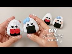 two crocheted amigurt dolls are being held by someone's hands