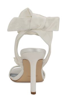 A voluminous floral appliqué adds a dose of whimsy to an occasion-ready sandal fashioned with satin straps that wrap around the ankle. 3 1/2" heel Wraparound ankle strap with tie closure Textile upper/synthetic lining and sole Imported Satin Sandals With Wrapped Heel, Satin Sandals With Heel Strap And Open Heel, Satin Sandals With Wrapped Heel And Open Heel, Satin Sandals With Wrapped Heel And Open Design, Satin Sandals With Wrapped Heel And Open Back, Satin Sandals With Wrapped Heel And Open Toe, Spring Open Toe Sandals With Satin Bow, Satin Sandals With Wrapped Heel And Ankle Strap, Satin Ankle Strap Sandals