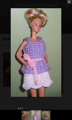 the doll is wearing a dress made from crochet