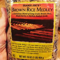 trader joe's brown rice medley is being held up in the palm of someones hand