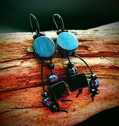 These one of their kind earrings feature handmade artisanal turquoise blue and black disc beads by MysticPeasantBeads, black thread dangles with two large shiny black Agate stone cubes, ten black faceted crystals and four Turquoise Picasso finish Czech glass beads.   They are strung in modern black ear wires. Return to my shop: JewelryBySmita.etsy.com All copyright & intellectual property rights in my designs, products, images & text are the property of Smita Luthra. All rights reserved. -------------- Blue Black Earrings, Black Crystal Dangle Earrings, Black Agate Gemstone Earrings, Unique Turquoise Blue Disc Earrings, Bohemian, Handmade Adjustable Blue Earrings With Black Beads, Artisan Black Bead Dangle Earrings, Artisan Black Beaded Drop Earrings, Artisan Black Beaded Dangle Earrings, Black Artisan Drop Earrings, Blue Dangle Earrings With Black Beads, Blue Dangle Jewelry With Black Beads, Artisan Dangle Earrings With Black Beads, Artisan Black Drop Earrings