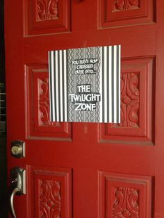 a red door with a sign on it that says you have never chosen to be the twilight zone