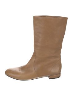 Prada Leather Mid-Calf BootsBrownRound-ToesExposed Zip Closure at SidesFit: This style typically runs a half size small.Unfortunately, due to restrictions, this item may not be eligible for shipping in all areas. Prada Boots Beige, Prada Leather, Mid Calf, Boot Shoes Women, Leather Boots, Prada, Shoe Boots, Running, Women Shoes