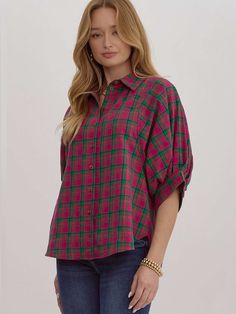 This oversized plaid button-down top offers a relaxed fit and effortless style. Featuring a collared neckline and half sleeves, the top includes button closures at the cuffs for an adjustable fit. Its vibrant magenta and green plaid pattern makes a statement, while the lightweight, woven fabric ensures comfort throughout the day. Unlined and non-sheer, it's perfect for layering or wearing on its own for a casual, laid-back look. SIZE & FIT Fit is true to size Model is 5'10" wearing size small FA Holiday Glam Outfits, Magenta And Green, Holiday Outfits Christmas, Night Out Tops, Plus Model, Nashville Style, Glam Outfit, Dolman Top, Plus Size Cardigans