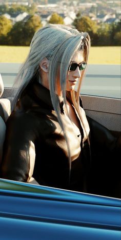 a woman sitting in the back seat of a car with long blonde hair and sunglasses on