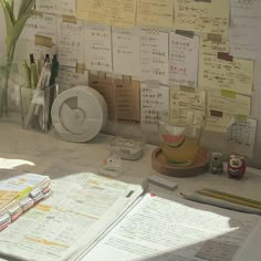 a desk with papers and pens on it