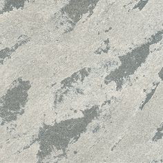 a close up view of the surface of a marbled wall with grey and white paint