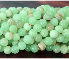 some green beads are sitting on a table