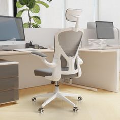 an office chair sitting in front of a computer desk