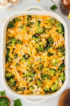 a casserole dish filled with broccoli and cheese