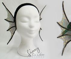 the headpieces are decorated with green and gold leaves