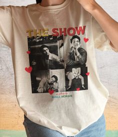 a woman wearing a t - shirt with photos of the show on it's front