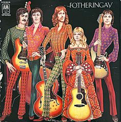 an album cover with three women in colorful outfits, one holding a guitar and the other standing