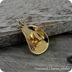 This Cowboy Hat Charm comes with a gold jump-ring as pictured. Please note that photo is not to scale and may appear larger to show detail. Refer to exact measurements below.Additional attachments (lobster clasp, large-hole bead, necklace chains) are available from the charm-attachments drop-down menu.  For a visual example of the different attachments and what each one is best suited for, scroll through the photos until you see the example photo or visit https://etsy.me/2BY7DAW for detailed inf Adjustable Gold Western Hat, Adjustable Gold Hats For Gifts, Adjustable Gold Hats As Gift, Handmade Gold Hat For Gift, Handmade Adjustable Gold Hats, Gold Cowboy Hat, Hat Jewelry, Rodeo Cowgirl, Chapeau Cowboy