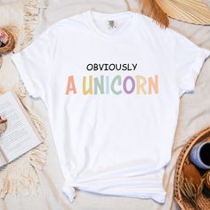 Obviously A Unicorn Comfort Colors shirt, Funny Shirt women, Unicorn lover gift, Unicorn t-shirt, Sarcastic Shirt, Fantasy animal shirt ---  ABOUT THE FEATURES ---  All of our t-shirts are machine washable, just make sure to wash them inside out and do not tumble dry as this may affect the body. All of our T-Shirts are made from 100% semi combed Ringspun cotton, our T-shirts are high quality, heavy (190gsm) and super soft.  T-shirts have a ribbed collar with reinforcement tape on the back. The products we use are Comfort Colors 1717 Garment-Dyed Heavyweight T-shirts. --- Comfort Colors 1717 Unisex Heavyweight Tee Features---  -6.1 oz./yd² (US), 10 oz/L yd (CA), 100% ring spun cotton, 20 singles -Garment-dyed soft ring spun fabric -Relaxed fit -Topstitched, classic width, rib collar -Twill Funny Shirts Women, Unicorn Tshirt, Unicorn Lover, Sarcastic Shirts, Comfort Colors Shirt, A Unicorn, Animal Shirts, Funny Shirt, Twill Tape