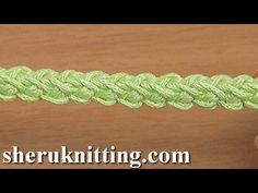 a close up of a green crochet ribbon on a wooden surface with the words, sheru ru