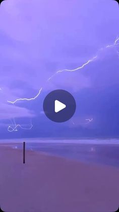 a purple sky with some lightning in it