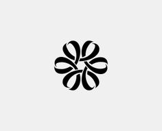 a black and white logo with an abstract flower design on it's left side