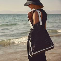 Raffia Tote in Black Sea | James Perse Los Angeles Modern Summer Shoulder Bag With Leather Handles, Chic Straw Bag With Leather Trim, Luxury Straw Bag For Everyday Summer Use, Luxury Black Straw Bag For Summer, Luxury Black Summer Straw Bag, Luxury Black Shoulder Bag For Vacation, Luxury Summer Bag With Leather Trim, Black Straw Bag With Leather Handles For Summer, Chic Vacation Shoulder Bag With Leather Trim