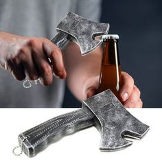 a person holding an open beer bottle with two hammers attached to it and another hand that is opening the bottle