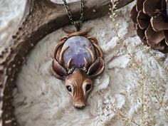 » One-of-a-kind deer pendant with an amethyst crystal 𝗦𝗜𝗭𝗘 Pendant: 3.5" inches Necklace Length: 10"  inches 𝗦𝗛𝗜𝗣𝗣𝗜𝗡𝗚 Necklace will come in bubble wrap, and be packaged in an upcyclable fabric bag. Small Packet™ does not come with tracking. If you would like a tracked package, select from one of the other available options. ---- Thanks for stopping by! If you have any questions, feel free to contact me through my main shop page. ★ Please read my Shop Policies and FAQ for additional i Deer Totem, Gifts For Witches, Deer Pendant, Goth Cottagecore, Totem Necklace, Witchy Necklace, Cottagecore Gifts, Deer Jewelry, Deer Necklace