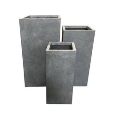 three cement planters sitting next to each other