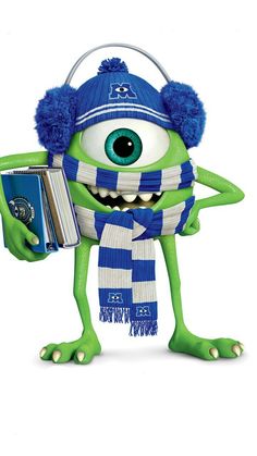 a green monster holding a book and wearing a blue knitted hat with big eyes