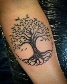 a tree with leaves and birds on it's arm is shown in black ink