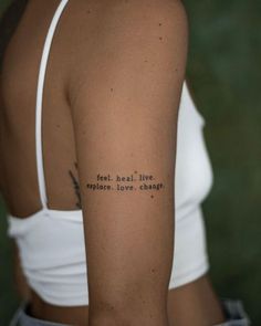 a woman with a tattoo on her arm that says, don't let the sun shine