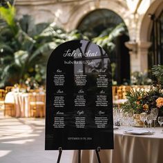 a black and white table plan sitting on top of a wooden easel