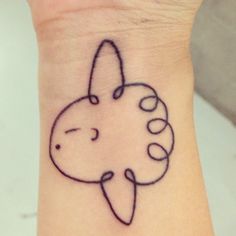 a small tattoo on the wrist of a person