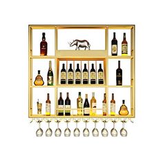 a shelf filled with lots of bottles and glasses next to each other in front of a white background