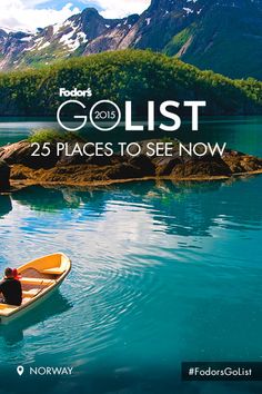 a man in a canoe on the water with mountains in the background and text that reads golist 25 places to see now