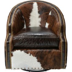 a brown and white cowhide chair with studded trim