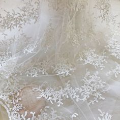 White Organza Lace With Intricate Embroidery, Embroidered White Lace In Organza, White Embroidered Organza Lace, Embroidered White Organza Lace, White Tulle Fabric With Lace Patchwork, White Tulle Fabric With Lace Work In Organza, Delicate White Lace Tulle Fabric, White Lace Trim Tulle, White Lace With Floral Embroidery In Tulle