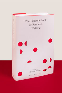 the penguin book of feminist writing is on display in front of a red tablecloth